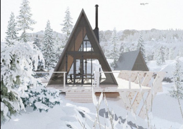 A-frame hus i snötäckt skogsmiljö med synliga träd och klar himmel.