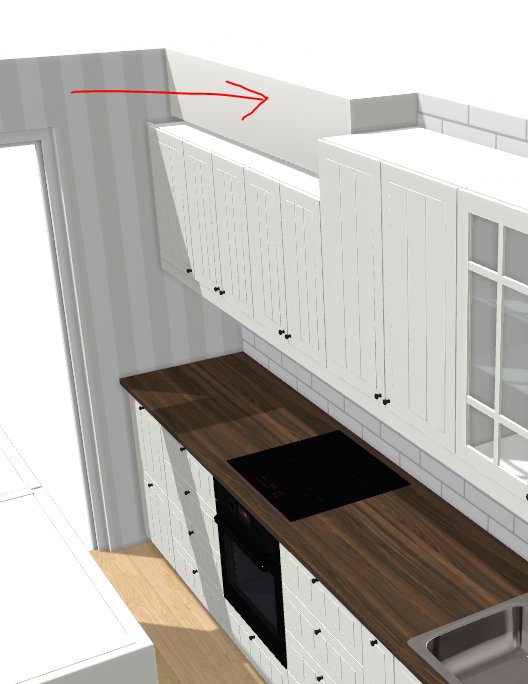 3D-renderad vit köksinredning, träbänkskiva, inbyggd spis och ugn, röd pil markerar något på väggen.