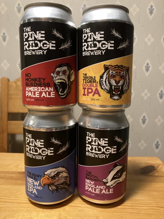 Fyra ölburkar från Pine Ridge Brewery med djurikoner: apa, tiger, örn och grävling.