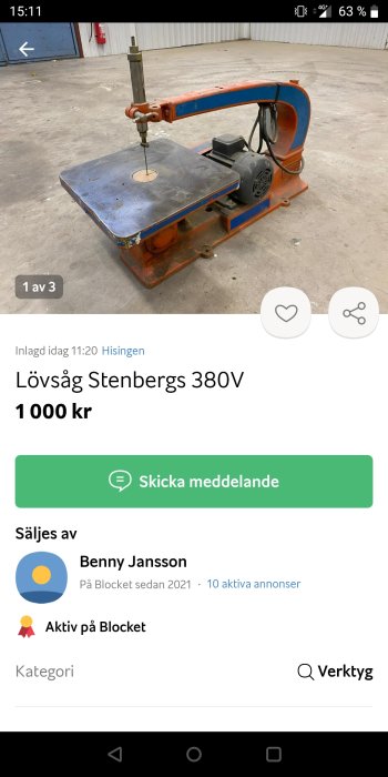 Orangefärgad bandsåg, industriell, på försäljningsplattform, betonggolv, titel "Lövsåg Stenbergs 380V", pris 1000 kr.