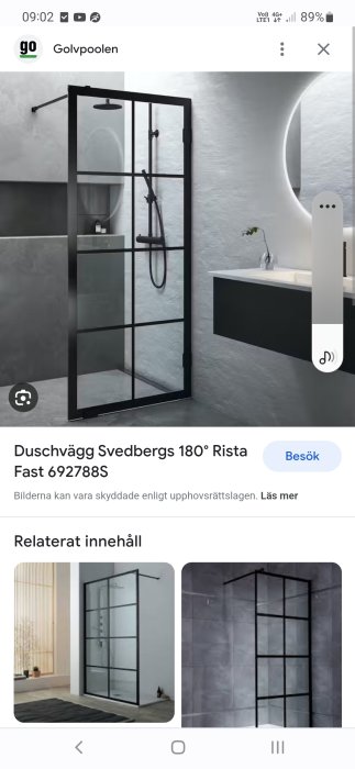 Modern duschvägg med svart ram i minimalistiskt badrum, grått kakel, betongväggar och svart blandare.