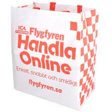 Vit shoppingkasse med rött mönster och text, ICA reklam för onlinehandel, slogan "Enkelt, snabbt och smidigt", webbadress.