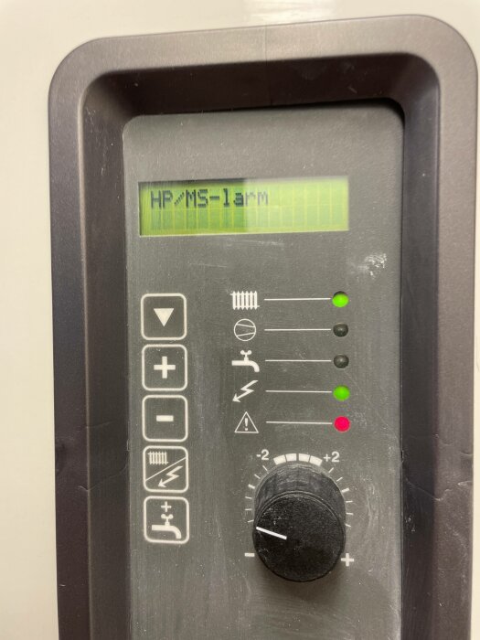 Digital display showing "HP/MS 1 arm", knob, buttons, green and red indicator lights on laboratory equipment panel.