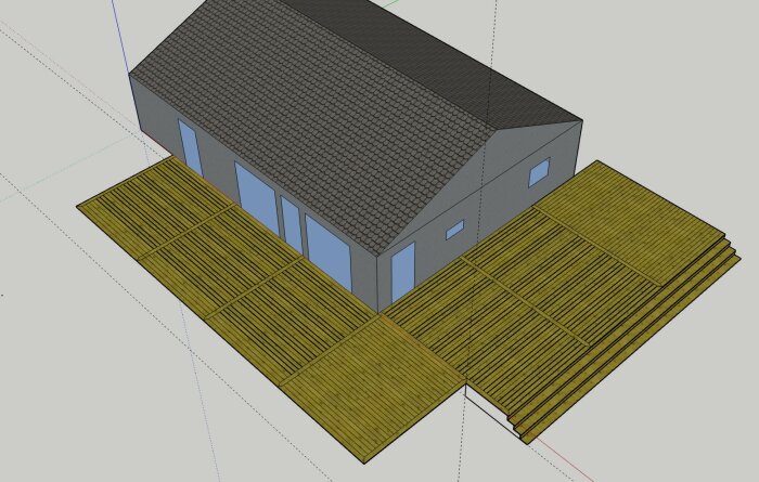 3D-modell av en industribyggnad med grå väggar, svart tak, blå fönster och gula träliknande golv.