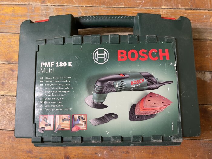 Bosch PMF 180 E Multi verktygslåda: sågning, skärning, slipning. Grön plast, slitage, flerspråkiga instruktioner.