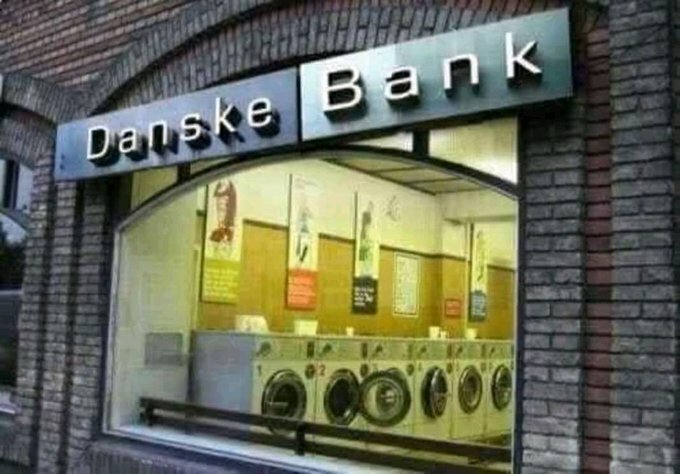 Skylt med "Danske Bank" på en byggnad med en tvättinrättning istället för en bank.