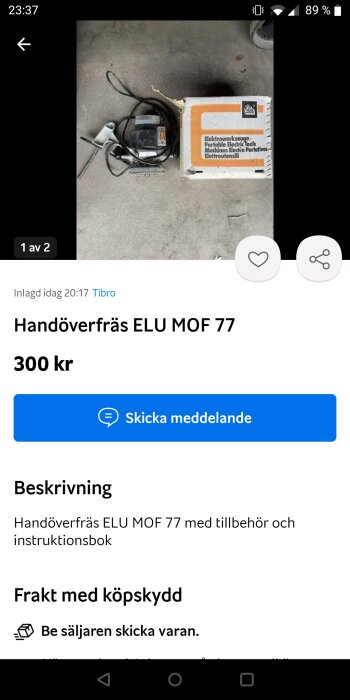 En handöverfräs och instruktionsbok på ett betonggolv, tillsammans med originalförpackning, till salu online.