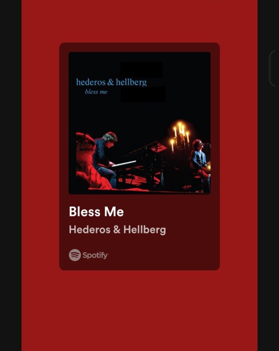 En skärmdump av ett musikalbum på Spotify, "Bless Me" av Hederös & Hellberg, röd bakgrund, två musiker.