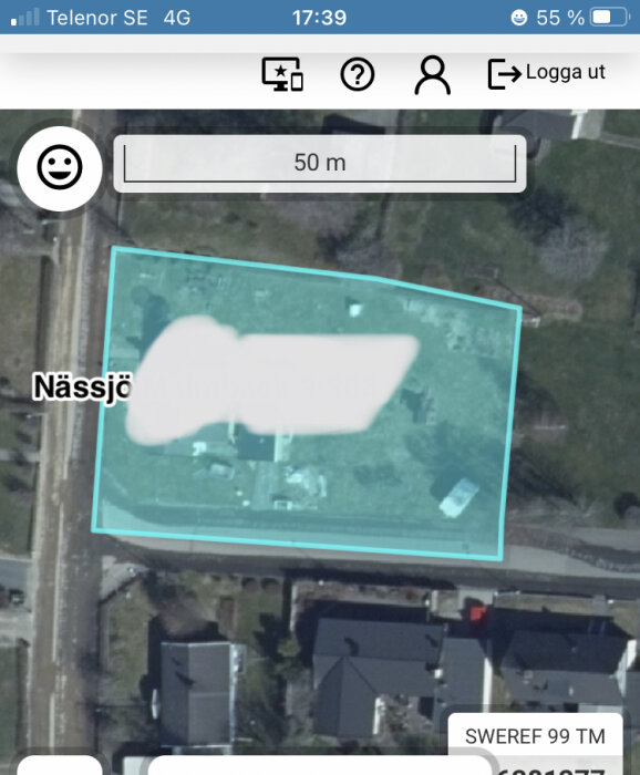 Satellitbild från mobilapp, överstruket område, gator och byggnader, text "Nässjö", skärmgränssnittsdetaljer.