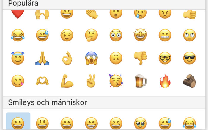 En skärmavbild på en samling populära emojis med olika ansiktsuttryck och symboler.