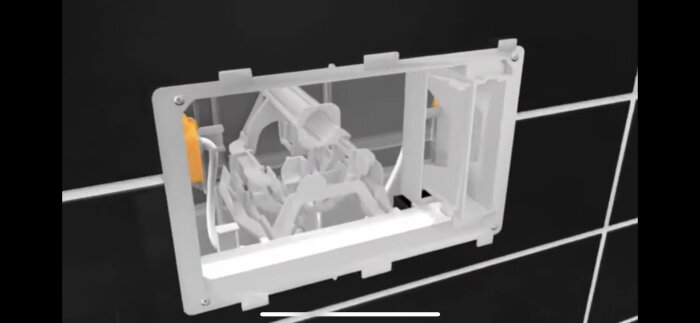 Vit komplex 3D-modell inuti ram, troligen mekanism eller maskindel, mot mörk bakgrund.