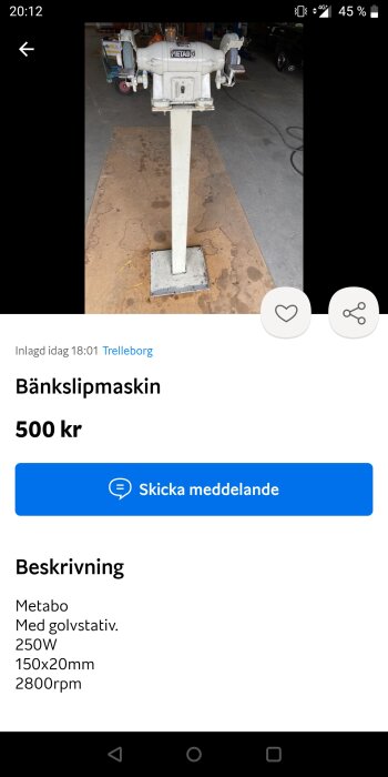 En Metabo bänkslipmaskin på golvet i en verkstad, upplyst för försäljning till priset av 500 SEK.