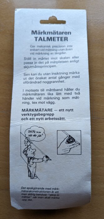 Etikett för verktyg "Märkmätaren TALMETER" med instruktioner och illustrationer på svenska för mätning och märkning.