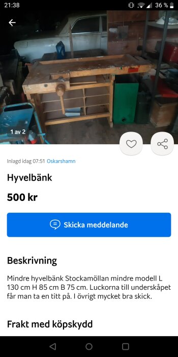 En hyvelbänk till salu, 500 kr, i en rörig verkstadslokal med äldre bil i bakgrunden.