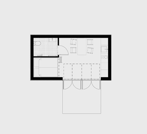 Svartvitt ritning av en lägenhetsplan med utsatta möbler och rum.