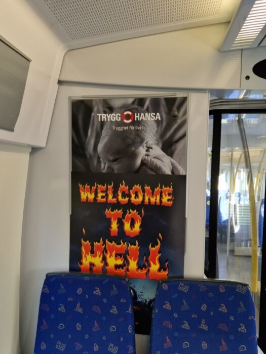 Affisch i kollektivtrafik, kontrastfullt budskap "WELCOME TO HELL", spädbarn, försäkringsbolagets reklam "TRYGG HANSA".