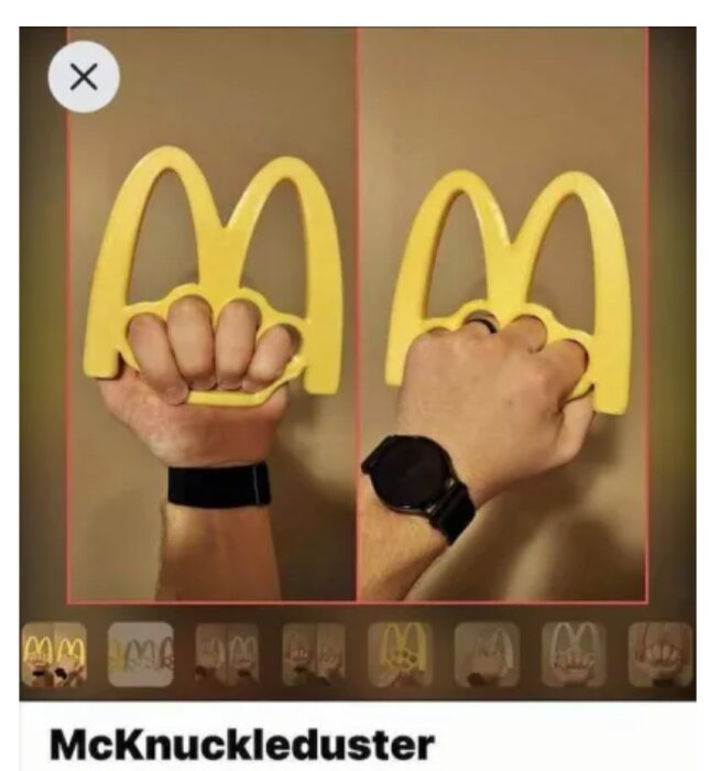 En hand håller en gul föremål formad som en känd restaurangkedjas logotyp. Humoristisk bildspel.