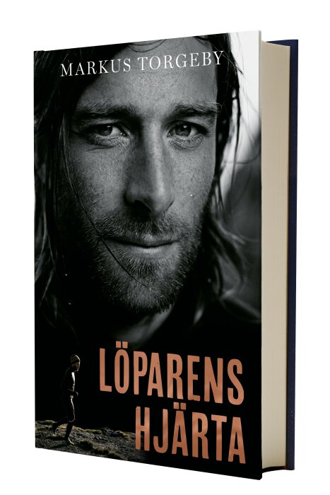 Bokomslag med porträtt av man, titeln "Löparens Hjärta", författare Markus Torgeby.