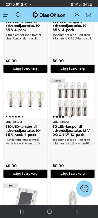 En skärmbild från Clas Ohlsons webbplats som visar LED-lampor för adventsljusstake, priser och "lägg i varukorg"-knappar.
