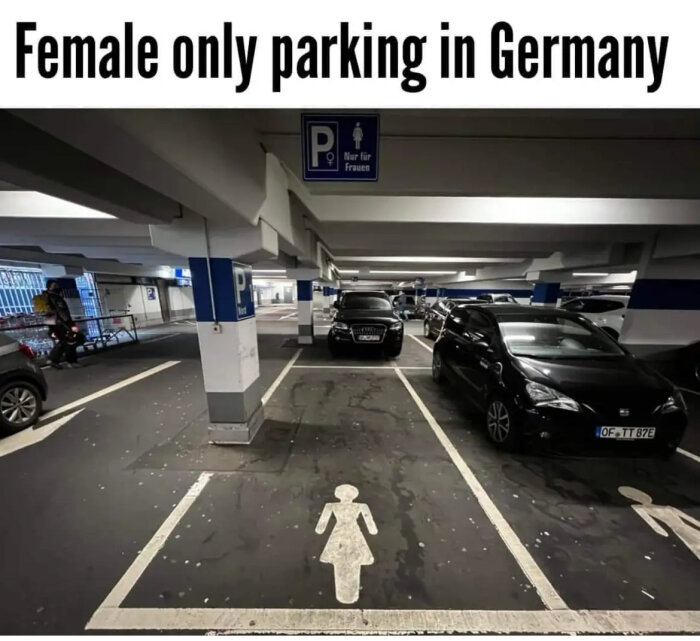 Parkering i garage reserverad för kvinnor, skyltat med "Nur für Frauen", bilar parkerade, piktogram på marken.