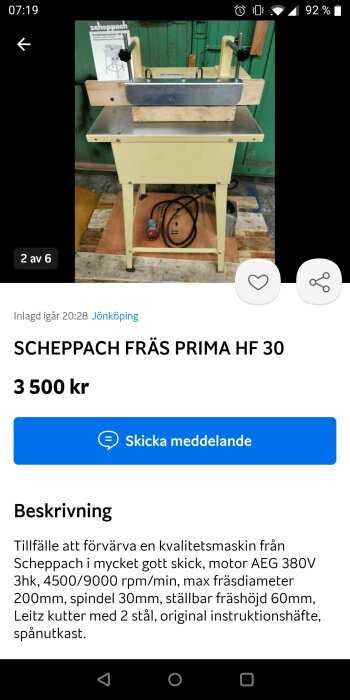 Scheppach fräsmaskin till salu med tillbehör och beskrivning, gult stativ, skickat meddelande-ikonen, bakgrund med gröna dörrar.