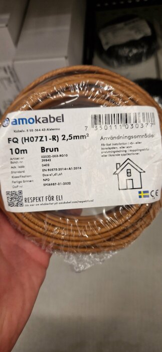 Kabelrulle, amokabel, 2,5mm² brun elektrisk kabel, 10 meter, plastförpackning, etikett med specifikationer.