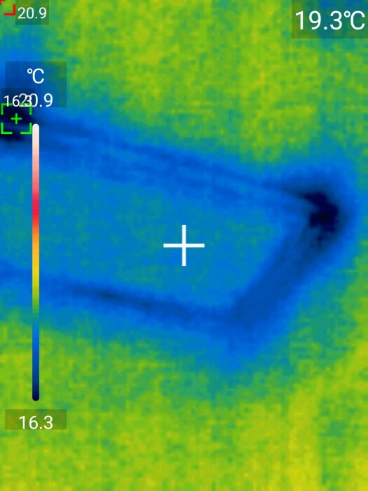 Termisk bild visar värmevariationer, sannolikt abstrakt objekt, med temperaturmätare och färgspektrum från blått till rött.