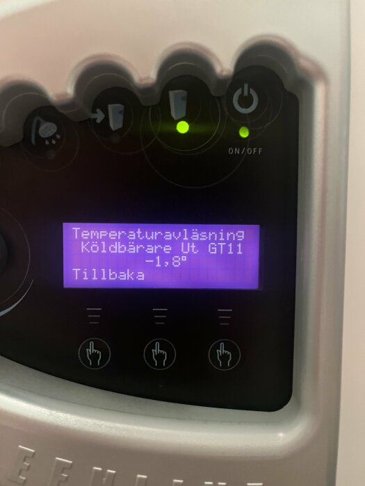 Digital kontrollpanel, temperaturinställning, svenska, minus en grad celsius, gröna indikatorljus, touch-knappar, grå bakgrund.