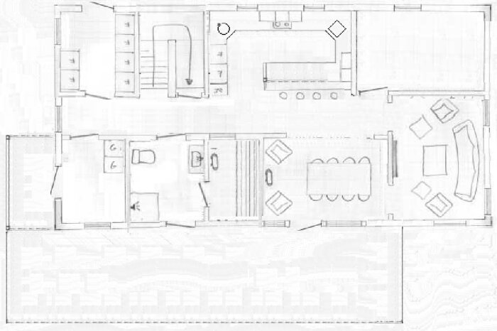 Svårtydd ritning av en våningsplanslayout med möblering, inklusive kök, badrum och vardagsrum.