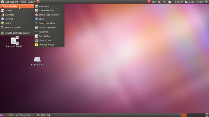 Skärmdump av Ubuntu Linux-skrivbord med öppen meny som visar program och inställningar.