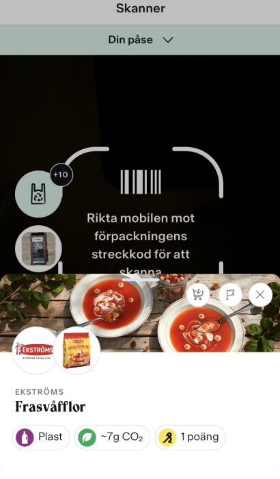 Skärmdump av mobilapp med skannerfunktion riktad mot förpackning av frasvåfflor med CO2-utsläpp och poäng.