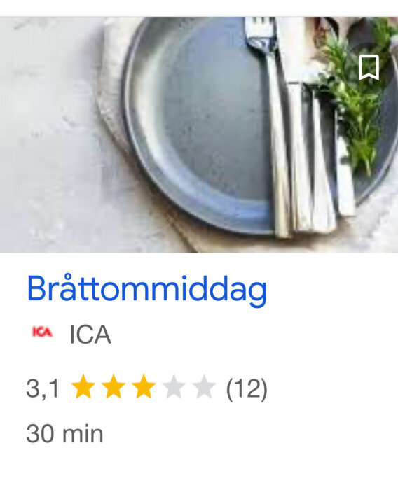 Tom tallrik med bestick och bröd på en betongyta, skärmbild från en matlagningsapp.