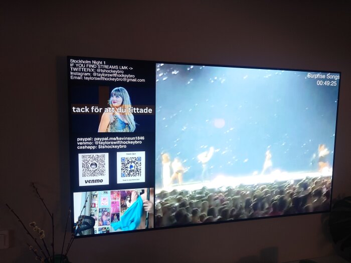 TV-skärm som visar konsert med artist på scen och publik, QR-koder och tackmeddelande.