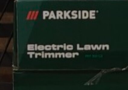 Förpackning med texten "PARKSIDE Electric Lawn Trimmer".