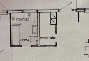 Floor plan showing two rooms labeled "Dusch" (shower) and "Bad" (bathroom), with another area labeled "wardrobe.