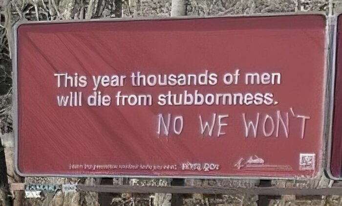 Röd billboard med texten "This year thousands of men will die from stubbornness." Någon har klottrat "No we won't" under originaltexten.