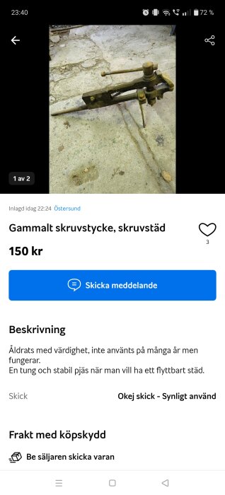 Bild av ett gammalt skruvstäd som säljs för 150 kr, placerat på ett slitet betonggolv.