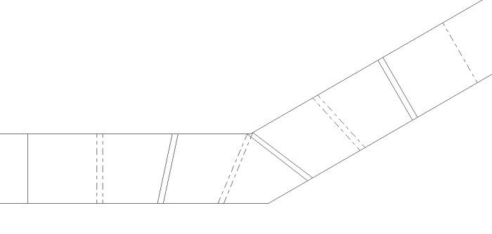 Ritning av ett lager konstruktion med streckade linjer som visar lagret under, med en diagonal sektion.