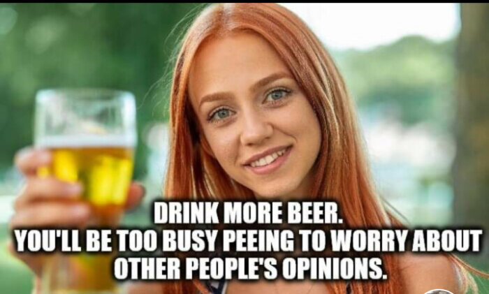 Leende person med långt rött hår håller upp ett glas öl. Text på bilden: "Drink more beer. You'll be too busy peeing to worry about other people's opinions.