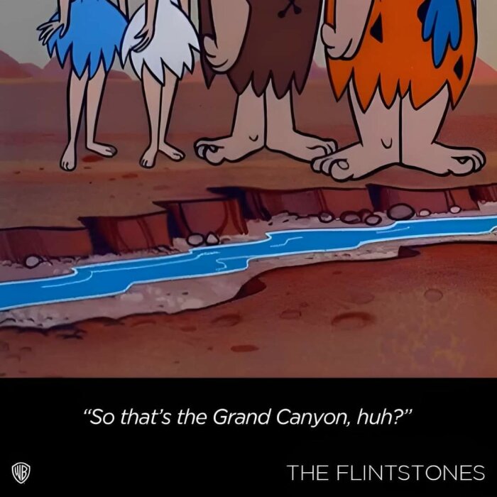 Tecknad vy av en canyon med en blå flod, och benen av karaktärer i förhistorisk stil står nära kanten. Texten "So that's the Grand Canyon, huh?