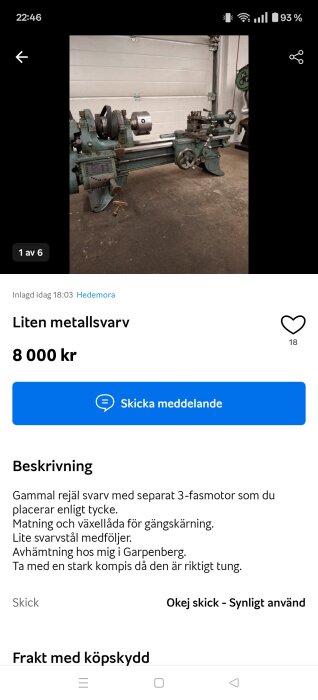 Bild av en grön metallsvarv med tre-fas motor, placerad i ett garage med betonggolv och vit vägg i bakgrunden.