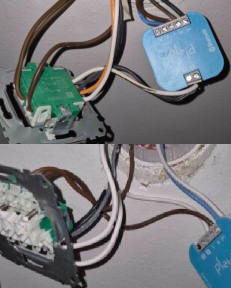 Två strömställare med anslutna kablar i olika färger, kopplade till blå och grön elektronikmodul monterade på väggen.