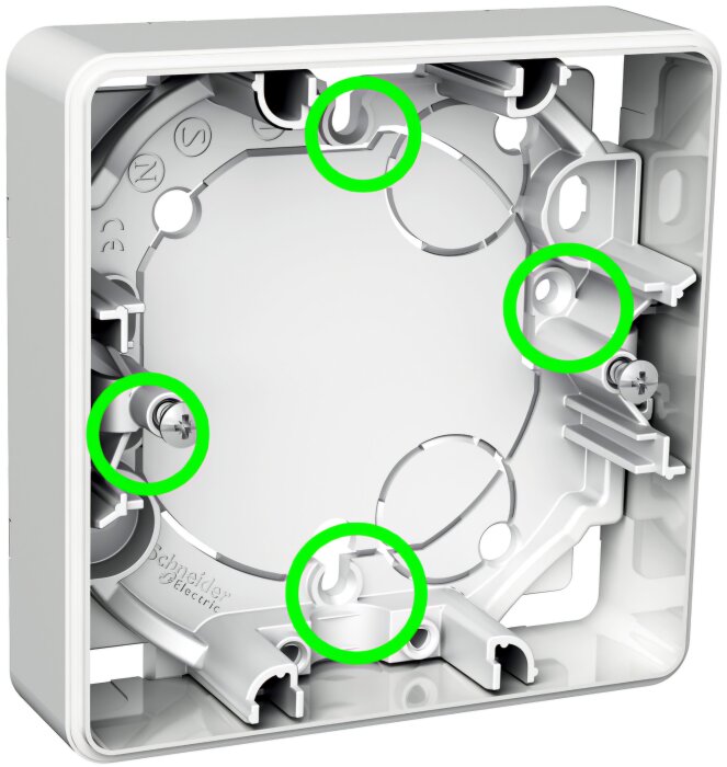 Närbild på en apparatdosa där fyra gröna cirklar markerar skruvhål för att fästa en ram.