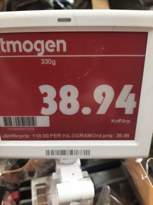 Prisskylt i butik med priset 38,94 kr för 330g vara, jämförpris 118 kr/kg, hos ICA-handlare.