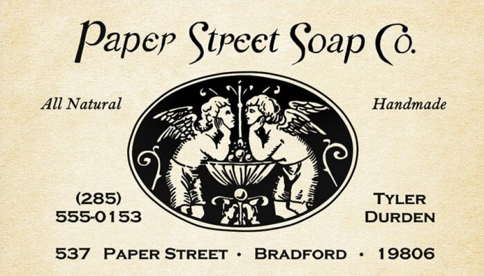 Vintage visitkort för "Paper Street Soap Co." med två änglar och kontaktinformation.