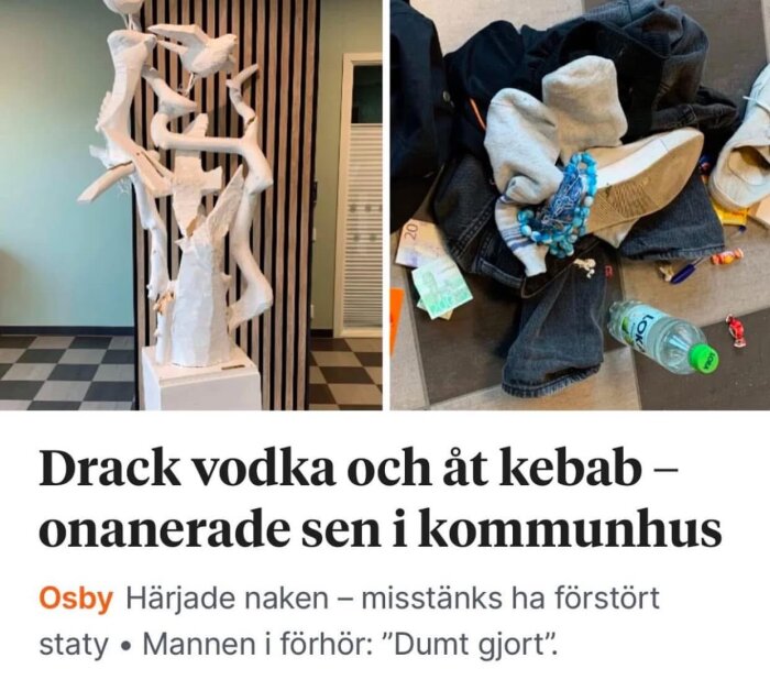 Vit skulptur av fåglar bredvid en hög med kläder, en flaska och konfetti på golvet i ett komunalhus.