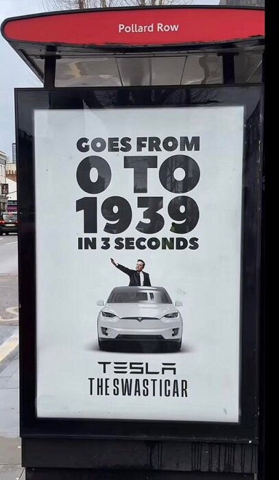 Reklamskylt med text "Goes from 0 to 1939 in 3 seconds" ovanför en Tesla med texten "The Swasticar" och en person poserande ovanpå.