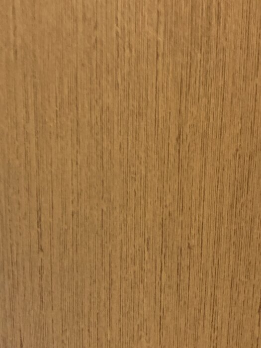 Yellow textured wallpaper, possibly vinyl, with vertical lines.