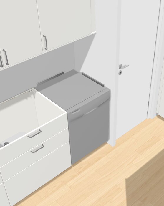 Diskmaskin installerad i ett IKEA-kök, placerad mot en vägg bredvid underskåp och diskbänk, med plats kvar för stenskiva ovanpå.