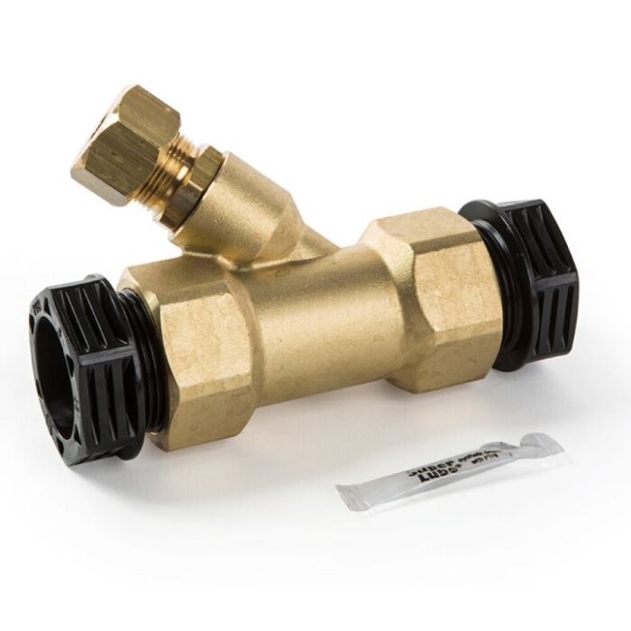 Ventil med mässingskropp och två svarta anslutningar, troligen för VVS, med smörjfettpaket bredvid.